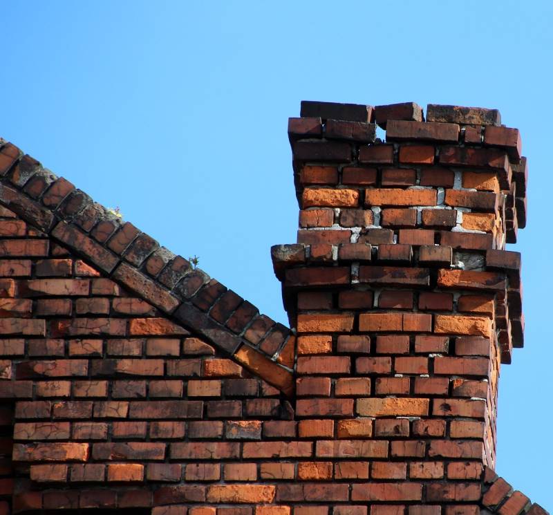 Signs Your Madison Heights Home Needs a Chimney Inspection Damaged chimney on an Madison Heights home showing cracks and missing mortar